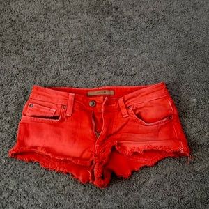 selling bright orange shorts, booty short, Y2K, good condition